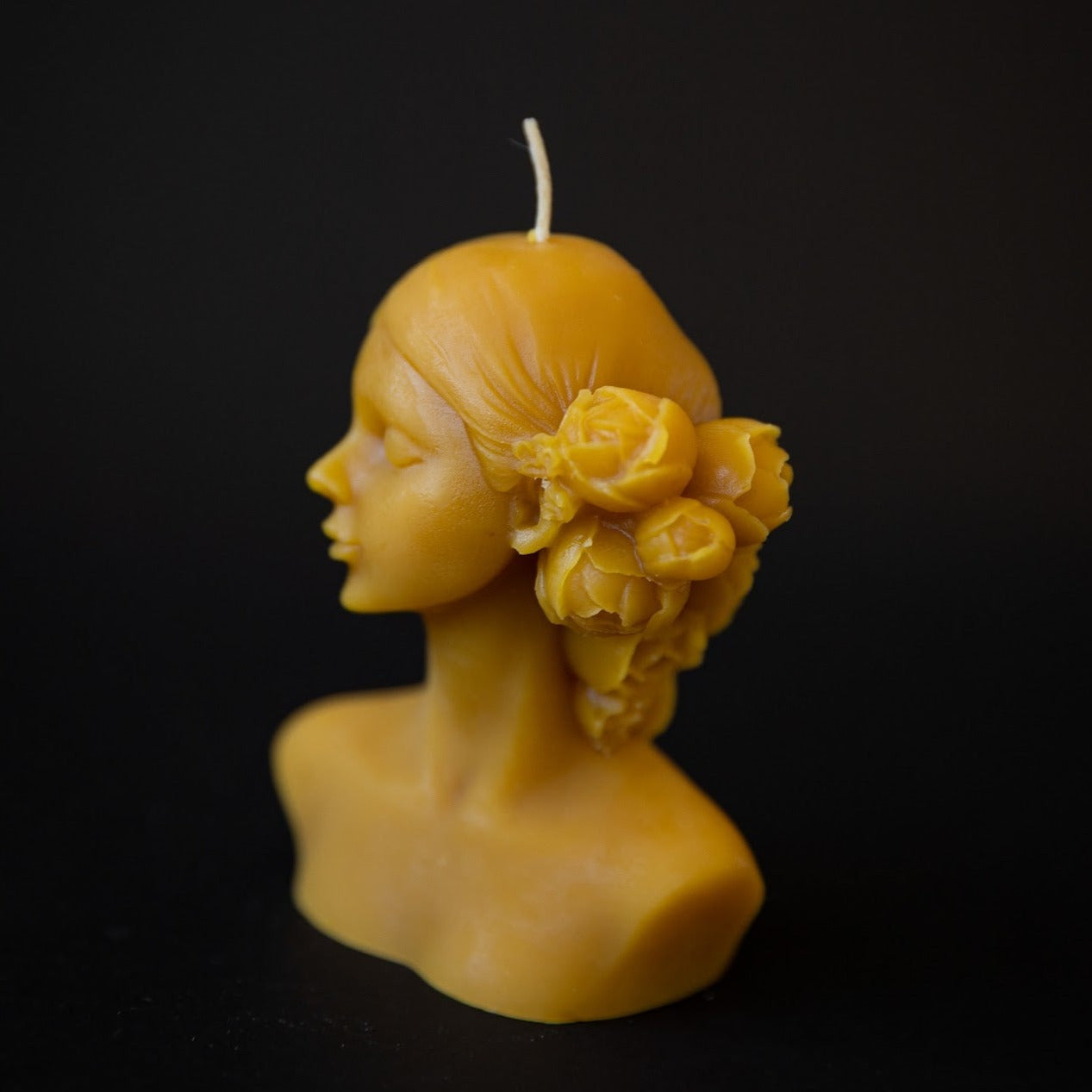 beeswax candle form lady bust with flowers in her hair